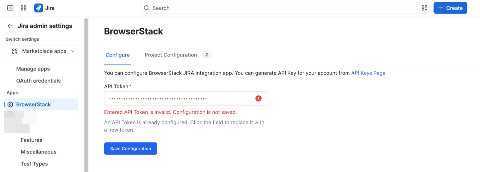 The Configure tab with the API Token field outlined in red and the message Entered API Token is invalid. Configuration is not saved.